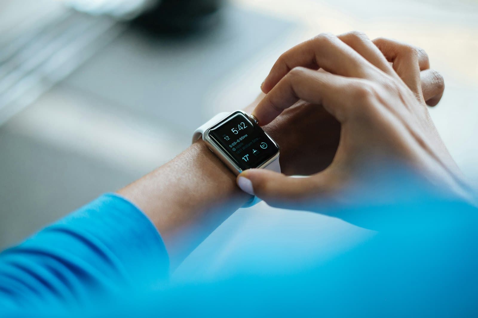 Athlete checking a fitness watch during training